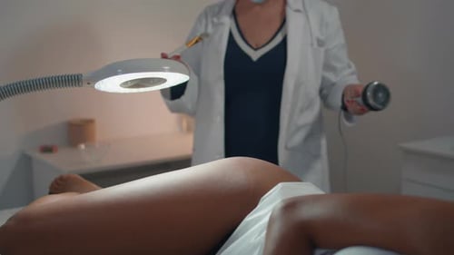 Closeup Cosmetician Applying Gel Before Anti Cellulite Procedure in Spa Salon
