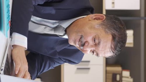 Vertical video of Winning businessman happy.