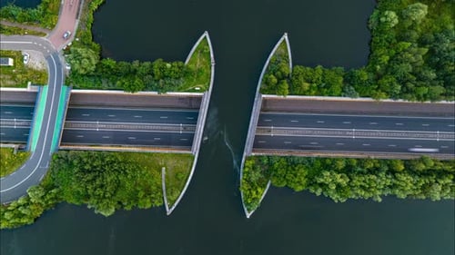 Timelapse Shot on a Tripod From a Unique Aerial Perspective Captures Traffic on a Street Passing