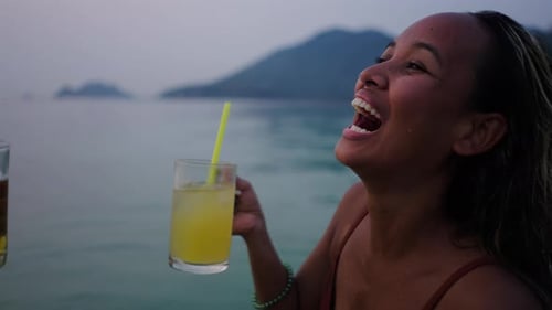 Closeup of a Couple Drinking a Toast in the Sea