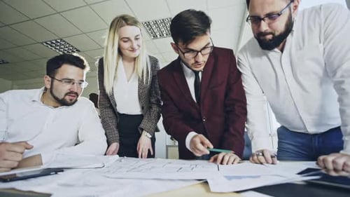 Team of Architects Working in Office
