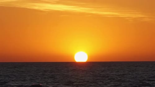Majestic ocean sunset timelapse with vibrant orange sky
