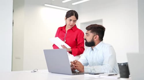 Focused Indian Professionals Collaborating at Work