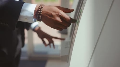 NEW YORK April 19 2019 Afroamerican Businessman Taking Money From ATM Cash Machine Removing a Credit