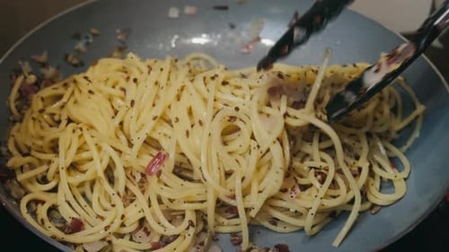 Pasta with herbs and vegetables in a pan