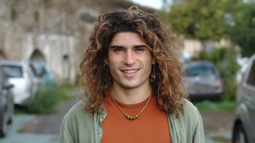 Young Adult Smiling in Urban Setting