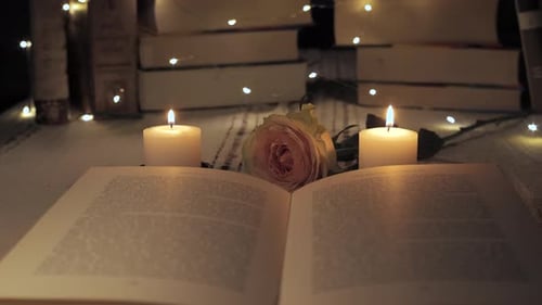 Open Book with Candles and Rose