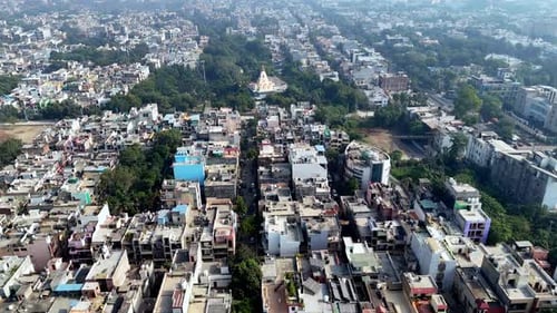 Busy Urban Cityscape Aerial View with Dense Buildings and Greenery