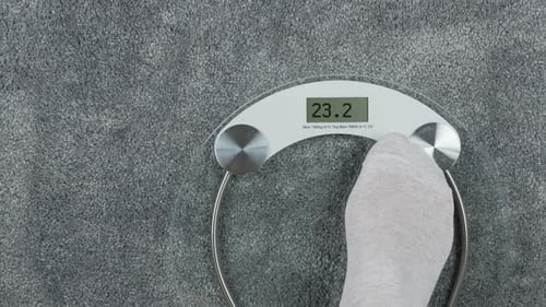 Feet on Scale Showing Different Weight Readings
