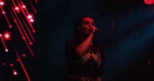 Talented Singer Performing with Lights at a Concert
