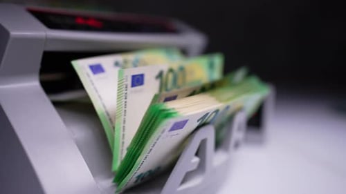 Counting Machine Counts Stacked 100 Euro Bills