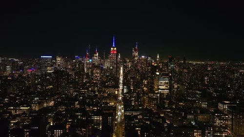 Aerial Views Capture Midtown Manhattan at Night Iconic Empire State Building and Illuminated