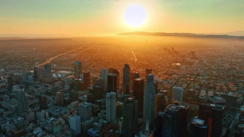 Scenic view of the sun-dazzled misty metropolis. Aerial perspective of Los Angeles, California, USA