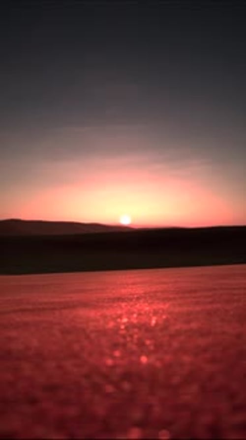Atemberaubender Sonnenaufgang über einer roten Landschaft Vertikal 01
