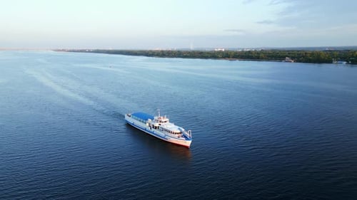 Passenger Ferry Navigating Calm River at Sunrise Clip