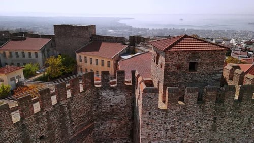 Aerial view of historic fortress with coastal landscape in Greece