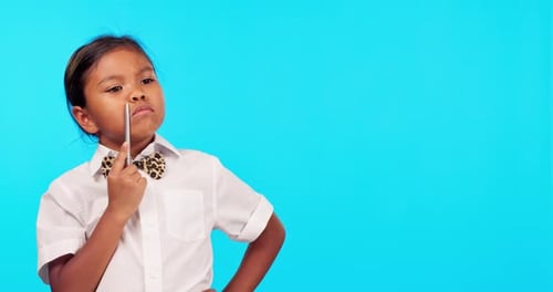 Decision, child thinking and against a blue background for choice