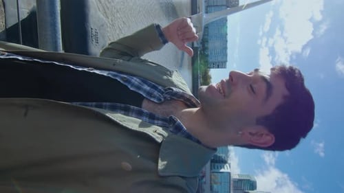 Blogger Showing City and Talking on Camera Outdoors