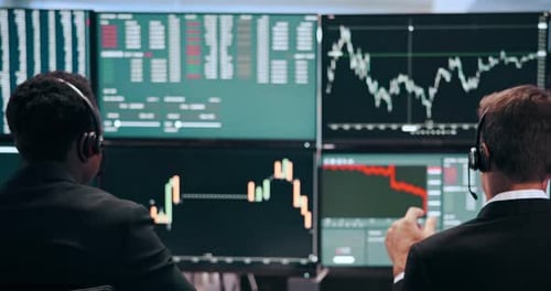 Stock Traders Analyzing Market Data in a Modern Office