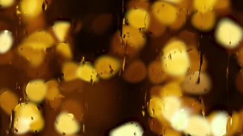 Animated raindrops with blur background.