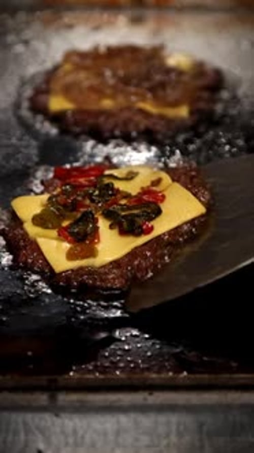 Grilling Juicy Beef Patties with Cheddar and Spicy Toppings