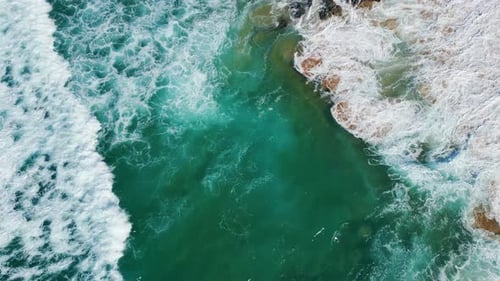 Drone View Powerful Waves Rolling on Beautiful Sandy Beach with Volcanic Cliffs
