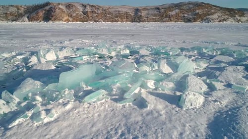 Aerial Over Crystal Clear Floes Hummocks and Blocks of Broken Unique Ice Lake Baikal Popular Tourist