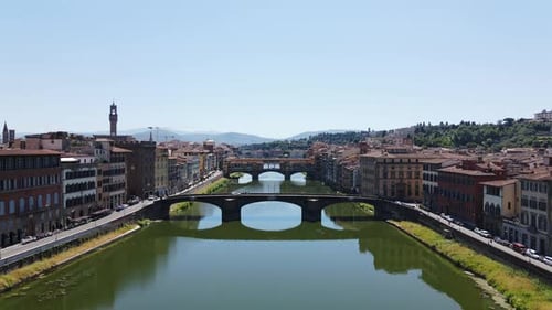 Exploring Ponte Vecchio Bridge in Florence - Scenic Aerial View Over River Arno