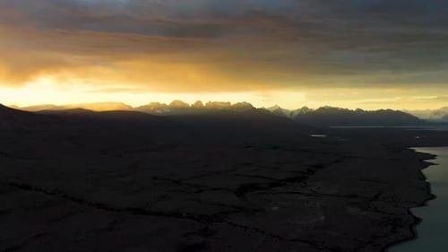 Sunset on lake and mountains