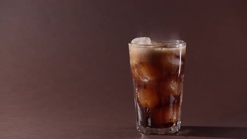 Iced Brown Soda Beverage in a Glass