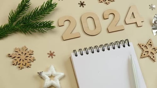 New Year Aims 2024 To Do List Empty Notebook at the Desk with Holiday Decoration Top View Creating