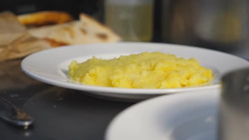 View of Hot Steaming From Delicious Cooked Mashed Potatoes on Plate at Kitchen