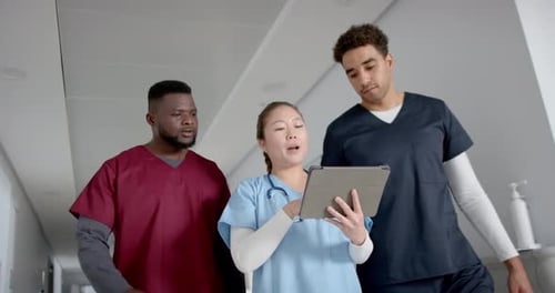 Medical professionals in a hospital corridor, with copy space