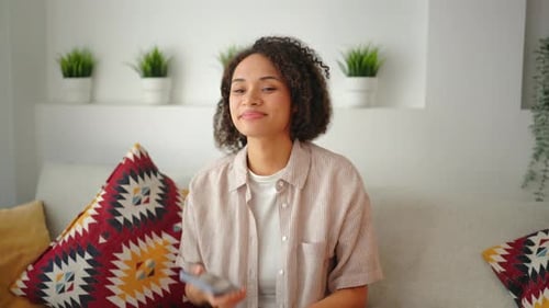 Happy Woman Chatting on Phone in Bright Home