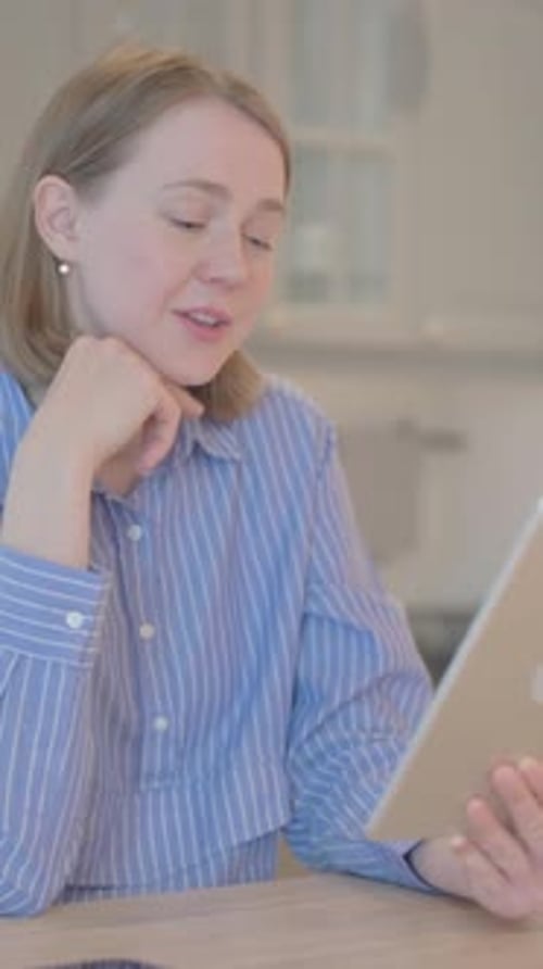 Woman Video Calling on Tablet in Home Setting