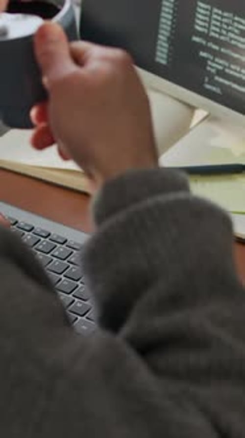 Vertical of Unrecognizable Male Programmer Working at Office Desk