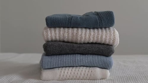 Stack of Folded Knitted Sweaters and Clothes