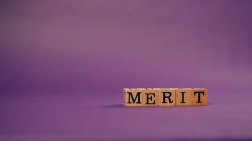 Wooden Blocks Spelling Merit on Purple Background