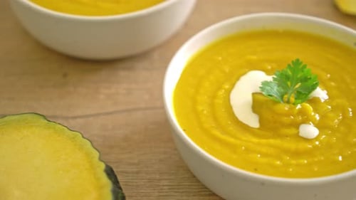 Bowl of Yellow Pumpkin Soup with Garnish