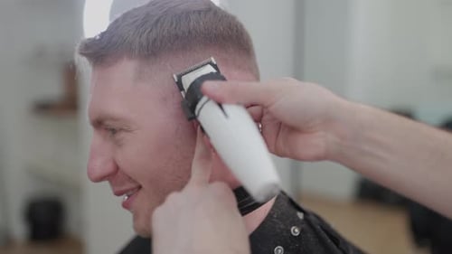 Man Getting a Haircut at Home with Clippers