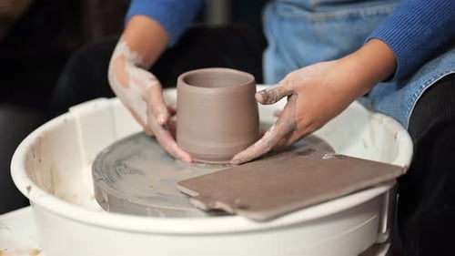 Professional Craftsman Potter Making Jug on Potter Wheel Circle