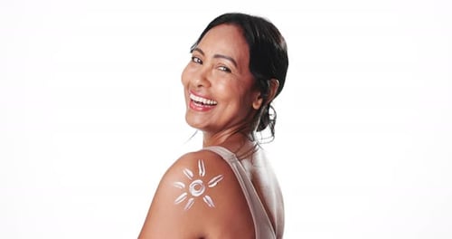 Face, shoulder and sunscreen with happy woman in studio for skincare, spf or uv protection
