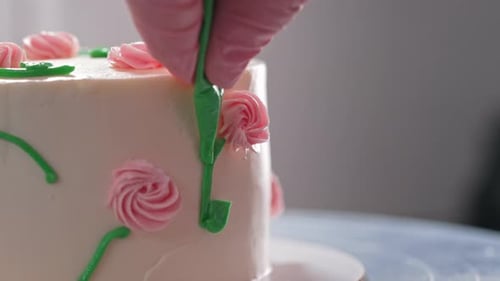 Decorating Cake with Pink Roses in Close Up