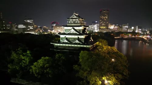 Aerial video of the Hiroshima skyline with Hiroshima Castle in Japan