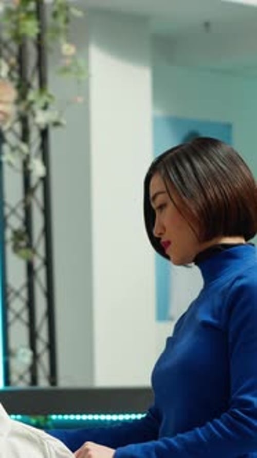 Vertical Video Middle Eastern Store Assistant Offers Fashion Advice to Female Client