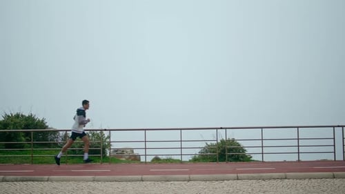 Sporty Guy Running Park in Fog Morning Motivated Athlete Training Jogging Track
