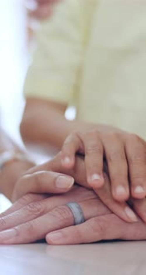 Family Hands Stacked Together Indoors