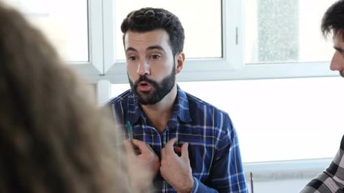 career, work - young career man discussing modus operandi with his colleagues