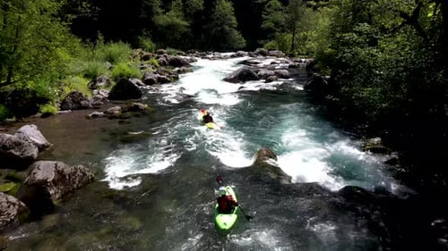 Aerial view of whitewater kayaker running class IV rapids on the Mill Creek section of the Rogue Riv