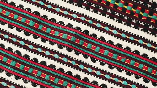 Closeup of colorful patterned textile with detailed weave